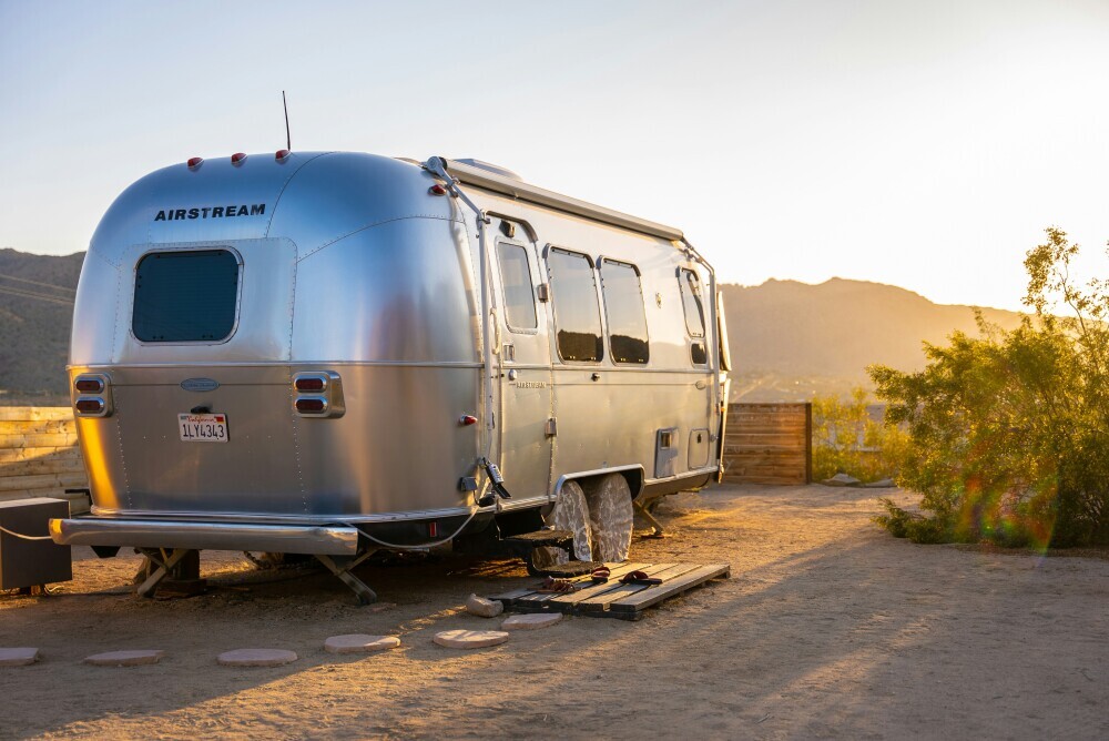 Airstream sitting at a campsite